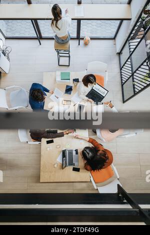 Afternoon Creative Office - Businesspeople Discussing Digital Marketing and Data Analytics Stock Photo