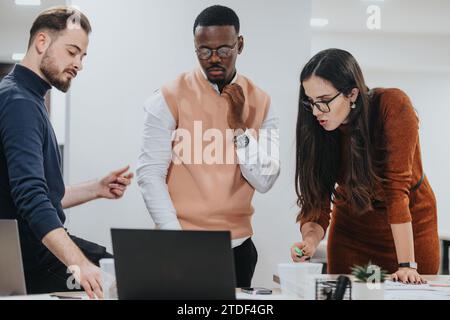 Employees collaborating, meeting deadlines, managing success through data analytics, market research, and e-commerce. Stock Photo