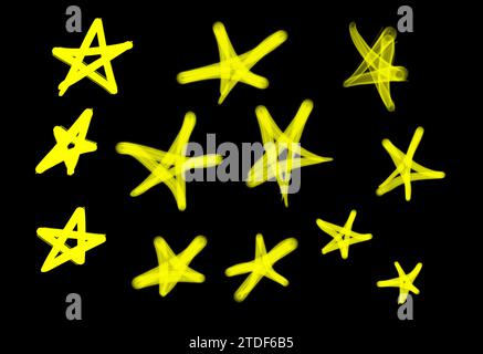Collection of graffiti street art tags with star symbols in yellow color on black background Stock Photo