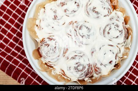 Freshly baked cinnamon rolls with cream cheese. Stock Photo