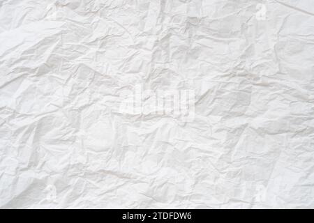 Wrinkled or crumpled white stencil paper or tissue after use in toilet or restroom with large copy space is used for background texture in decorative Stock Photo