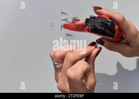 Crimping cable terminals with a tool Stock Photo