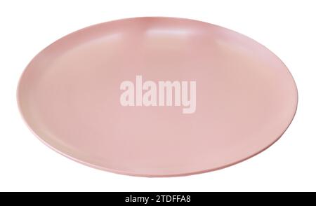 Beautiful pink ceramic plate is isolated on white background with clipping path. Stock Photo