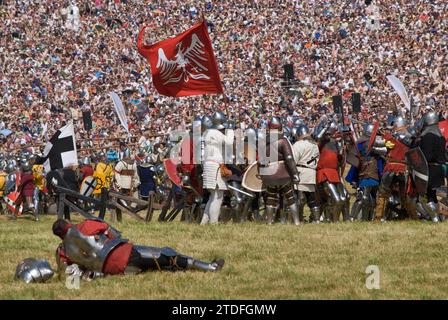 Reenactors and spectators at annual recreation of Battle of Grunwald which took place in 1410 when Polish and Lithuanian troops broke the power of Teutonic Knights, near village of Grunwald Warminsko-Mazurskie, Poland Stock Photo