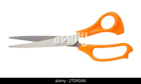 Single yellow or orange scissors is isolated on white background with clipping path. Stock Photo