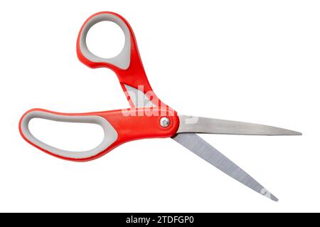 Single scissors with red handle is isolated on white background with clipping path. Stock Photo