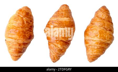 Top view of three separated fresh croissants in set is isolated on white background with clipping path. Stock Photo