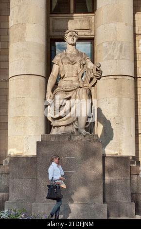 Socialist-realist style statue of heroic muse at Palace of Culture and Science, a symbol of Soviet domination in the past, in Warsaw, Poland Stock Photo