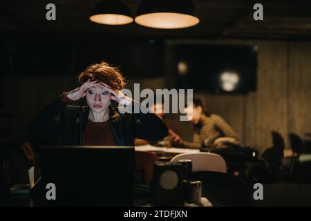Confident businesswoman discussing data analytics for financial optimization in a creative office. Stock Photo