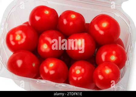Fresh cherry tomatoes in a plastic disposable container isolated on a white background. View from above Stock Photo