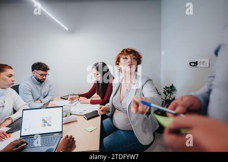 Business professionals collaborating in a creative office. Stock Photo