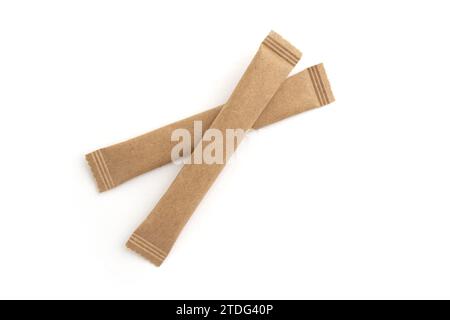 two sugar stick, sugar in paper kraft packaging, mock up for design isolated on white background Stock Photo