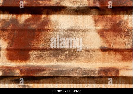 Abstract detail of section of of old, weathered, rusted, corrugated metal fencing. Stock Photo