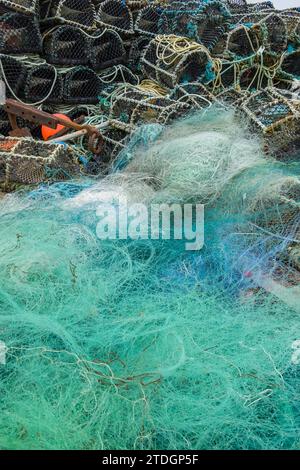 Turquoise fishing net and lobster baskets, Portmaggee, Ireland Stock Photo