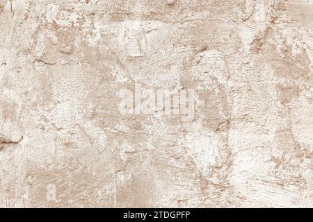 Vintage, old stucco plaster surface background, close up rough texture of brown and white mixed color painted cement, concrete wall texture. Wallpaper Stock Photo
