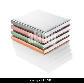 Stack of four diaries isolated Stock Photo