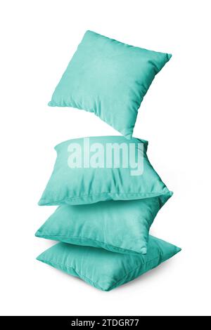 Stack of turquoise pillows isolated on white background. Pile of  decorative cushions for sleeping and resting, home interior, house decor. Stock Photo
