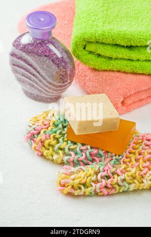 Bar soap, salt and towels Stock Photo