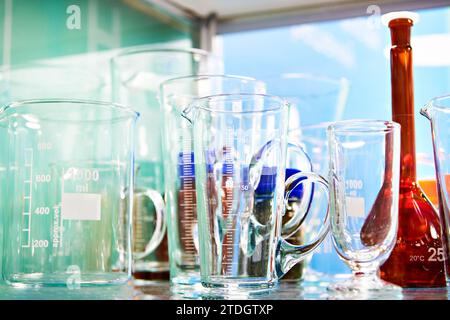 Laboratory glass dishes, bottles, jars and flasks in store Stock Photo