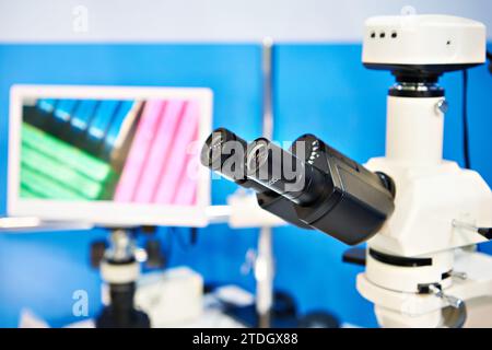 Eyepieces polarization stereo microscope and monitor Stock Photo