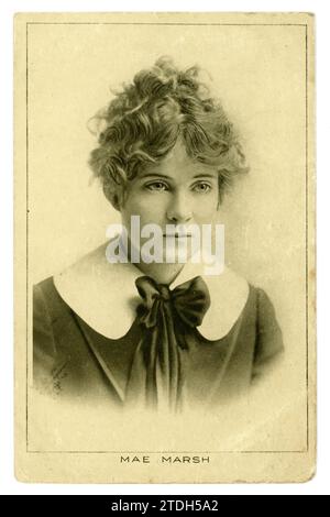 Original early 1900's postcard of young American silent film actress Miss Mae Marsh, with her hair tied loosely in a bun, wearing a blouse with Peter Pan collar, circa 1915 Stock Photo