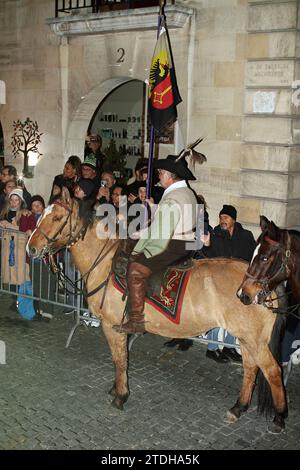 GENEVA; SWITZERLAND-DEC 10: Medieval horse rider in authentic suit with Geneva flag participant in the Escalade feast December 10, 2023 in Geneva, Swi Stock Photo