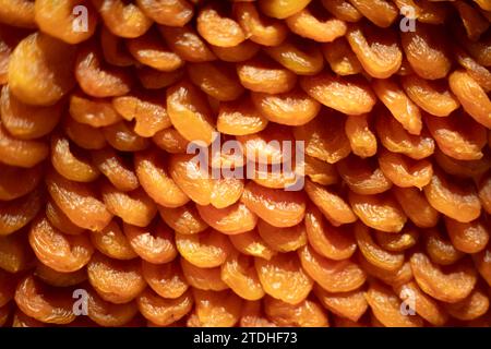 Dried apricot. Dried fruits in the store. Raisin texture. Sweet food made from natural ingredients. Stock Photo