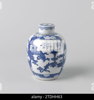 Ovoid covered jar with peachblossoms on 'crackled ice' and antiquities, anonymous, c. 1680 - c. 1720 Egg -shaped lid pot of porcelain, painted in underlaze blue. The body is covered with saved peach blossoms (prunus) against a background of 'crackled ice'. Two cartouches with valuables (Artemisiablad, Mint, Pearl) and Antiques (flower vase, incense burner, Ruyi-Skeptter, Drunkenpoot, Packaged Qin, Lotusrank). The lid with a saved, lobed cartouche with a flowering plant against a background of 'crackled ice'. The edge with a tire hanging Ruyi motifs. Blue White. China porcelain. glaze. cobalt ( Stock Photo