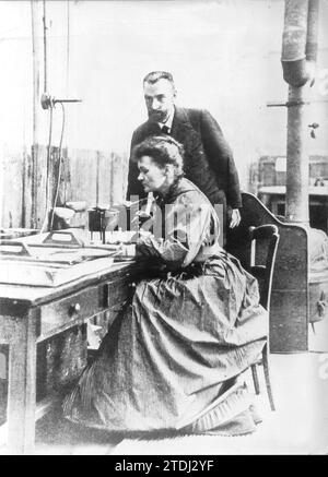 1898. Discovery of [[Radium]] by María and Pierre Curie: in the image both in their laboratory. Credit: Album / Archivo ABC Stock Photo