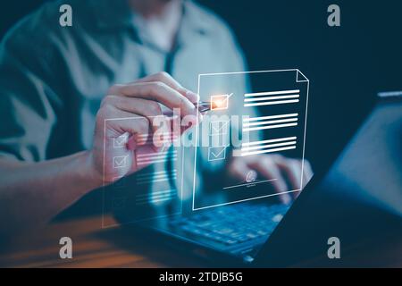 Document management or electronic signature concept, Businessman use laptop and check signature on electronic document at office, Digital network, Tec Stock Photo