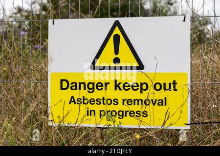 Danger sign for asbestos removal, Barry, Wales, UK Stock Photo