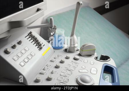 Ultrasound control panel and examination table in hospital, closeup Stock Photo