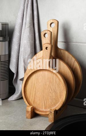 Wooden cutting boards on light grey countertop in kitchen Stock Photo
