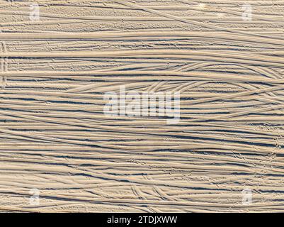 detailed aerial view of tire tracks on a beach Stock Photo