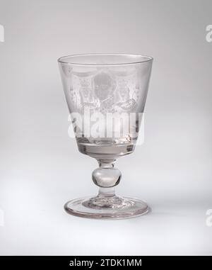 Chalip glass with a portrait of Willem II, Anonymous, 1847 Flat. Stam with massive, spherical knot. Conical chalice with flattened underside. On the chalice a portrait of King Willem II in the military outfit. On the downside, under a canopy, the crowned weapon of the Netherlands, stopped by two crowned lions. Under the weapon the motto: Je Maintiendrai. Signed on the foot: N L Hoevenaar 1847. glassblower: FranceNetherlands glass glassblowing Flat. Stam with massive, spherical knot. Conical chalice with flattened underside. On the chalice a portrait of King Willem II in the military outfit. On Stock Photo