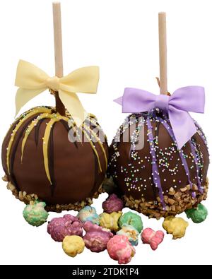 Image of chocolate covered apples, brightly colored caramel corn treats Stock Photo