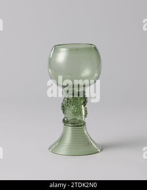 Roemer with two rows of Braamnoppen, Anonymous, c. 1750 - c. 1810 Roemer with inserted bottom on high, concave, spun from a wire. The spherical chalice and the trunk, which is occupied with two rows of blackberry naps, are blown separately. The transition from the chalice to the trunk is indicated by a ribbed thread. Netherlands glass glassblowing Roemer with inserted bottom on high, concave, spun from a wire. The spherical chalice and the trunk, which is occupied with two rows of blackberry naps, are blown separately. The transition from the chalice to the trunk is indicated by a ribbed threa Stock Photo