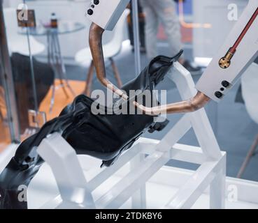 Robot arm demonstrate spot welding car part. Smart industrial manufacturing in automotive factory. Stock Photo