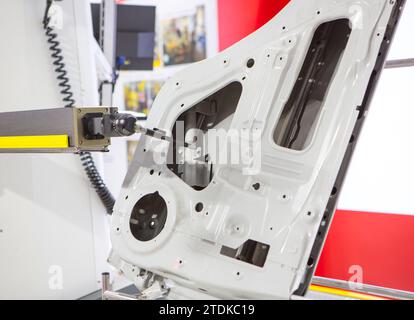 CMM Coordinate Measuring Machine probe inspecting car parts. Industrial manufacturing. Stock Photo