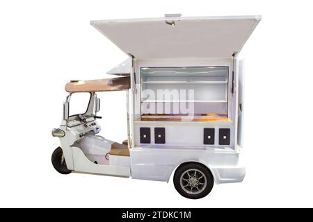 Electric Tuk Tuk EV commercial food truck with empty shelves isolated on white background. Stock Photo