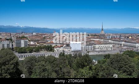Cityscape of Turin, Italy, featuring the iconic Mole Antonelliana building that stands out among the city's skyline. Stock Photo