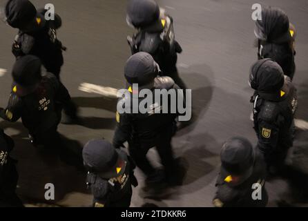 Dresden, Germany. 18th Dec, 2023. Police officers accompany a demonstration of the right-wing extremist movement Pegida along the Terrassenufer. Credit: Robert Michael/dpa/Alamy Live News Stock Photo