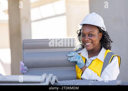 Portrait smart success black women worker african female work in construction industry happy smile in construction site. Stock Photo