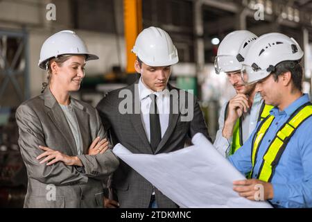 group of industry people engineer brainstorm team builder architect and technician talking consulting together in site building for renovation plannin Stock Photo