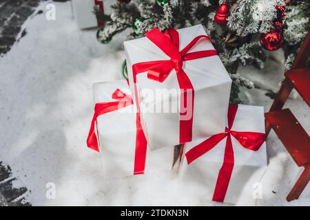 christmas gift box new year present  in winter holiday season concept with white snow background Stock Photo