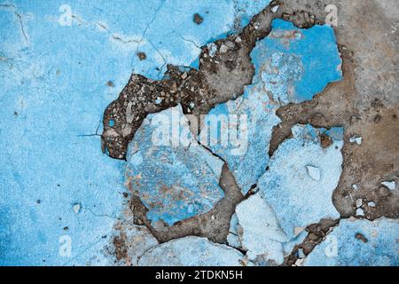 Cracked concrete wall texture pattern of color crack concrete pavement damage fractured construction background Stock Photo