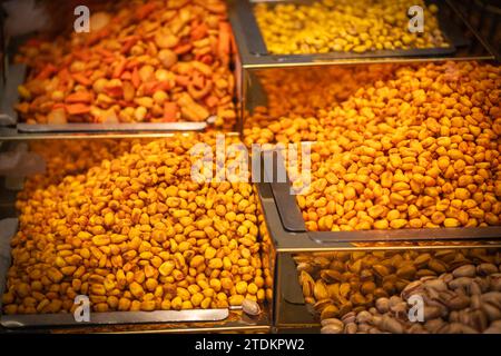 Nuts and beans at the street Bazaar in a Middle East. Dried food products on the arab street market stall. Colorful spice shop. Nobody, street photo Stock Photo