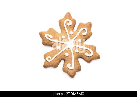 Christmas Gingerbread cookie of a snowflake with icing isolated on white Stock Photo