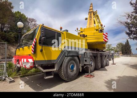 Mobile crane at construction site heavy truck big Stock Photo