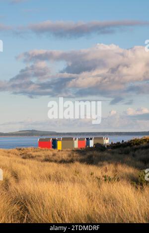 Beach huts on Findhorn beach. Morayshire, Scotland Stock Photo